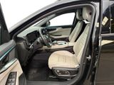 the interior of a car with the door open and the driver ' s seat down