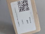 a tag on a stuffed animal that has a qr code attached to it