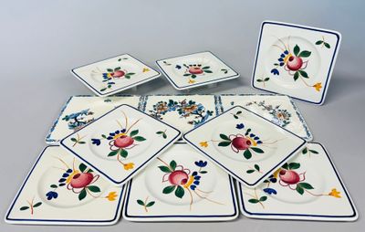 un grand nombre d'assiettes posées sur une table