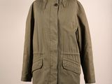 an olive green parka with black fur collar and cuffs