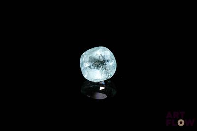 an image of a glowing blue ball on a black surface