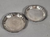pair of silver plated dishes on a table
