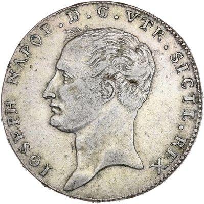Gros plan sur une pièce de monnaie portant le visage d'un homme