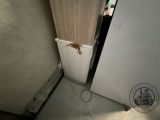 a white refrigerator and a white refrigerator freezer in a room
