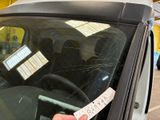 a sticker on the windshield of a car with a sticker on it