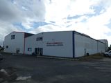 the building is white with blue trim and red trim