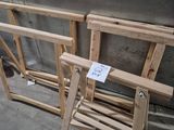 two pieces of wood sitting on the floor next to each other