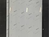 an image of a refrigerator in a warehouse with labels on it