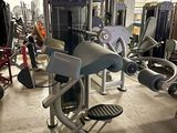 a gym room with machines and other equipment in it