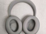 a pair of headphones sitting on top of a table