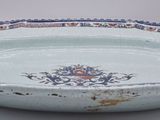 a blue and white bowl with a floral design on it