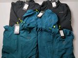 three pairs of men ' s running jackets with tags on them