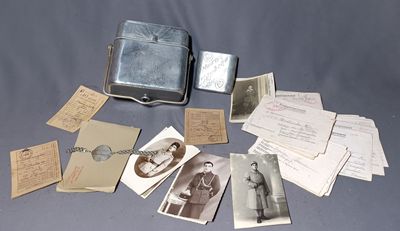 many old photos of men and women sitting on a table