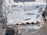 a broken tv sitting on top of a pile of trash