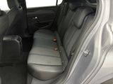 the back seats of a car with a suitcase in the back