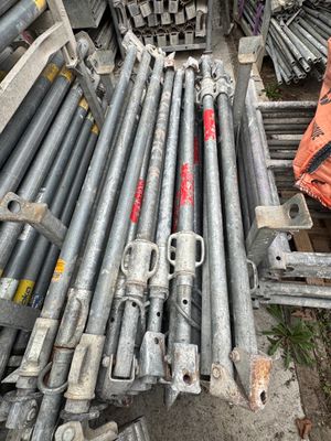 many different types of steel pipes stacked on top of each other