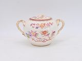 an image of a white teapot with a floral design on it