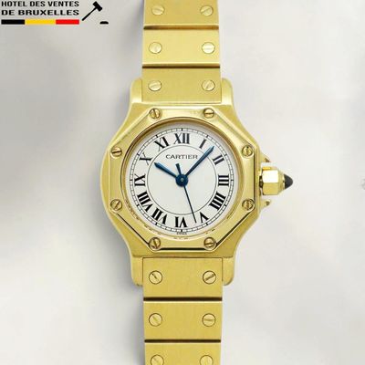 an image of a gold wrist watch with roman numerals and a white dial