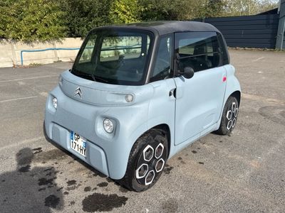 a small car that is parked in a parking lot