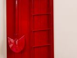 a red door in the corner of a room