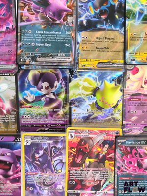 beaucoup de cartes pokemon différentes sur la table