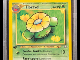 a close up of a pokemon card with a yellow flower on it