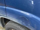 a blue van with a sticker on the side of it