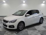 the white car is parked on a checkered floor in the garage