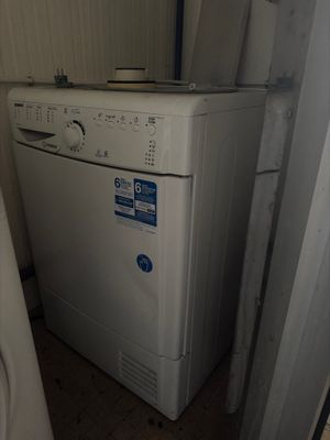 a washer and dryer in the corner of a room