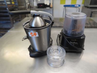 a juicer and blender sitting on a table