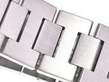 a close up of a stainless bracelet with a diamond on it