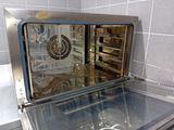 an oven that has a glass door on it