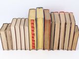a lot of books stacked on top of each other