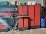 a red cabinet in a garage with many other tools