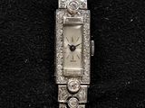 an image of a lady ' s wrist watch with diamonds on it