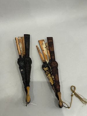 two umbrellas that are on a table with a string