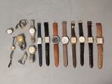 a lot of watches and cuff watches on the table