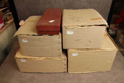 many boxes stacked on top of each other on the floor