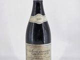 a bottle of wine that is sitting on a table