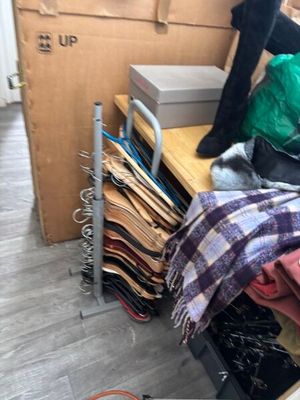 a pile of clothes sitting on top of a wooden table
