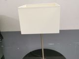 a small table with a lamp on top of it