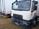 a white truck that is parked next to other trucks