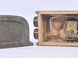 two old toasters sitting side by side on a white surface