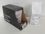 a box of coffee sitting on a table next to a bag of coffee