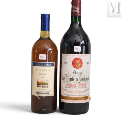 two bottles of wine sitting next to each other on a white surface