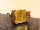 a small metal object sitting on top of a table