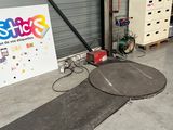 an image of a garage area with a sign and other items