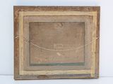 an old picture frame with a rope hanging from it ' s side