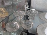a glass display case with a number of glass dishes