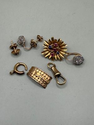 two pairs of gold and diamond earrings and a clasp